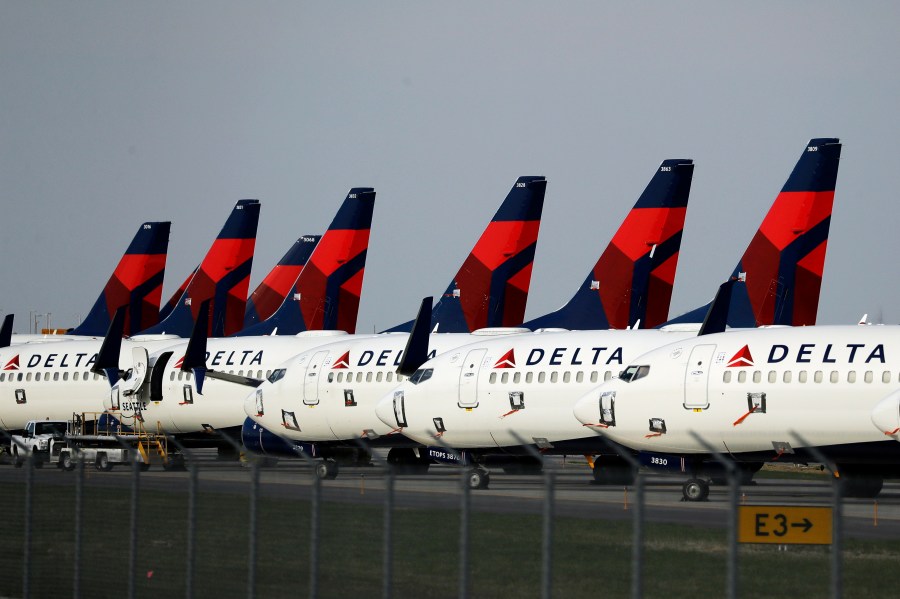 FILE - In this April 1, 2020, file photo, several dozen Delta Air Lines jets are parked at Kansas City International Airport in Kansas City, Mo. Delta is backtracking slightly on changes it previously announced in its frequent-flyer program, but it still plans to reshape SkyMiles to favor big spenders over customers who take the most flights. Delta outlined the revisions in an email from CEO Ed Bastian to SkyMiles members on Wednesday, Oct. 18, 2023. (AP Photo/Charlie Riedel, File)