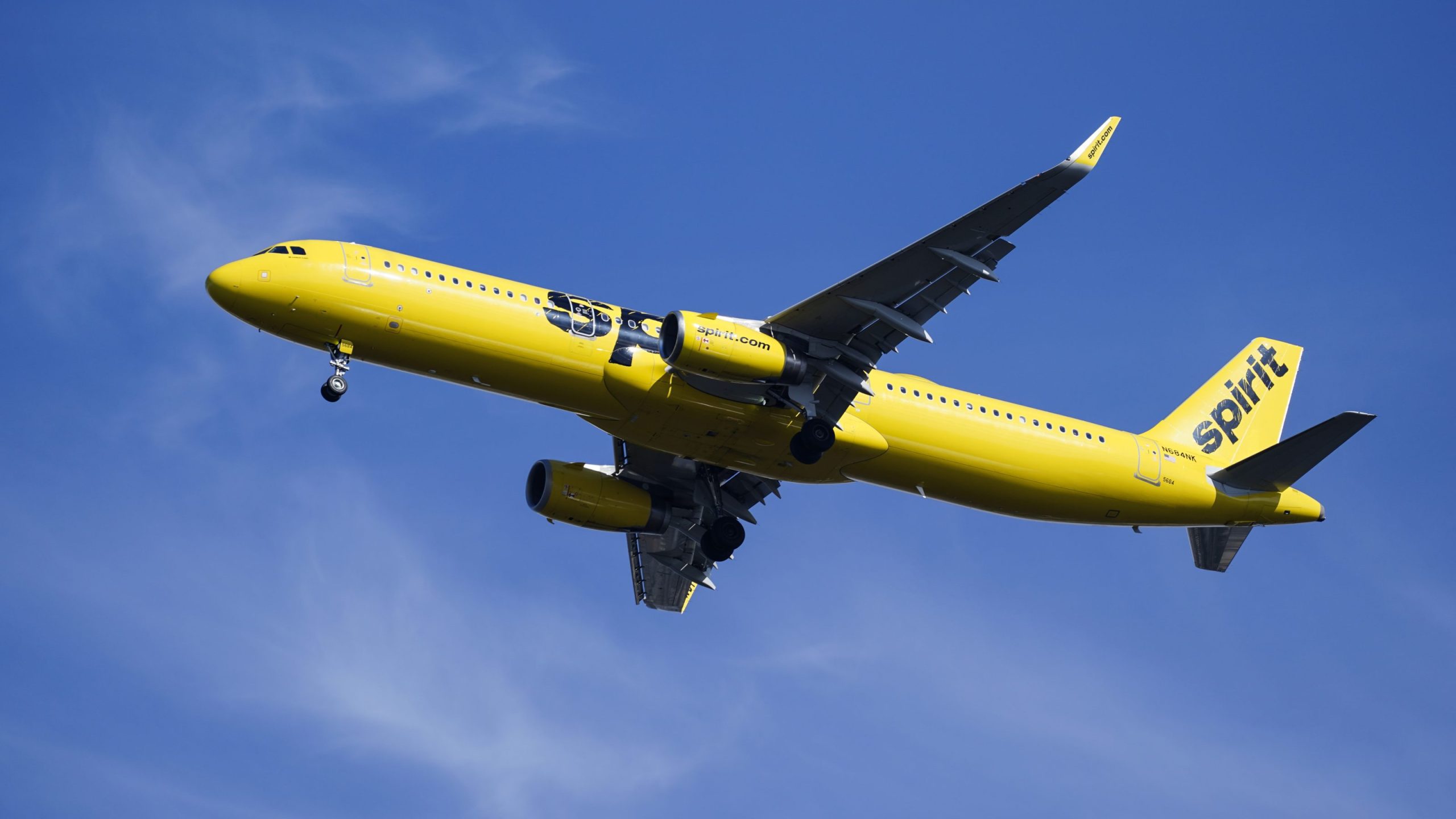 FILE - A Spirit Airlines jet approaches Philadelphia International Airport in Philadelphia, Feb. 24, 2021. (AP Photo/Matt Rourke, File)