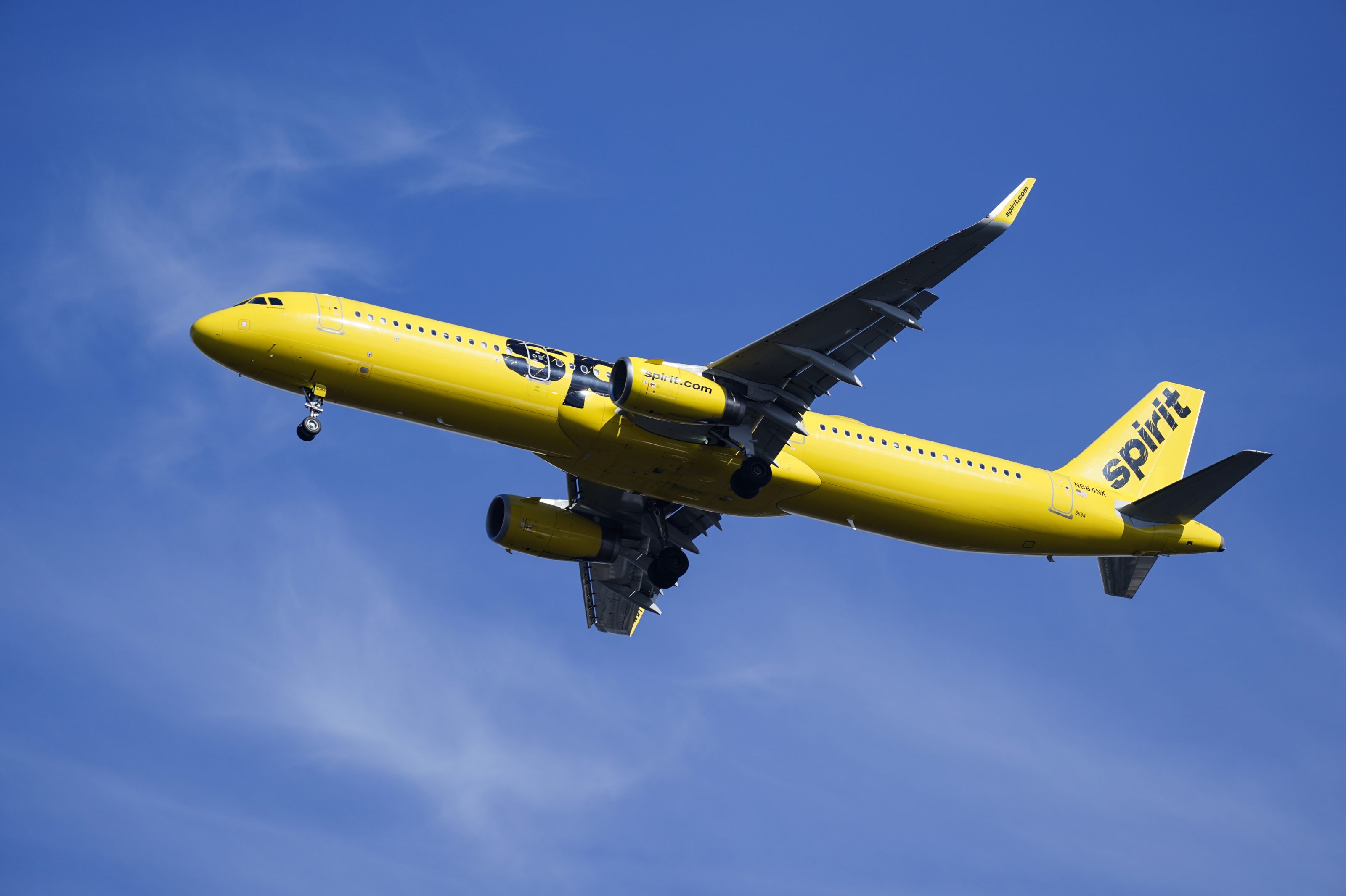 FILE - A Spirit Airlines jet approaches Philadelphia International Airport in Philadelphia, Feb. 24, 2021. (AP Photo/Matt Rourke, File)