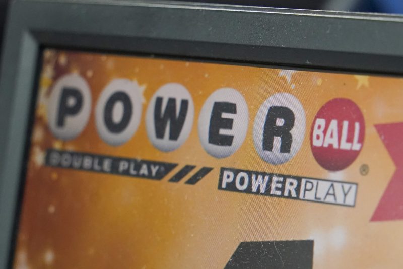 The display panel advertising the tickets for the Monday Powerball drawing with an annuity value of at least $1.9 billion, are shown at a convenience store, Monday, Nov. 7, 2022, in Renfrew, Pa. (AP Photo/Keith Srakocic)