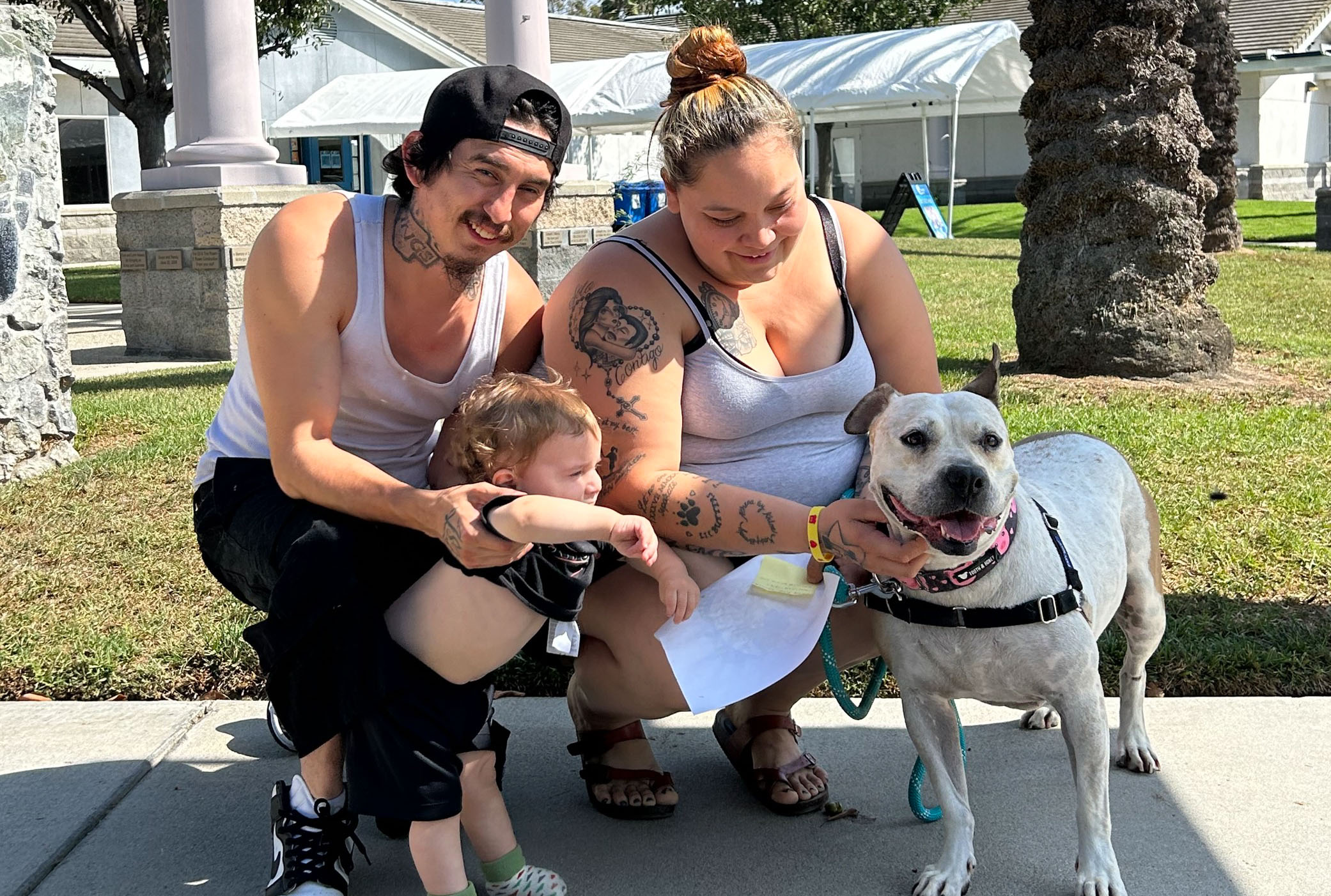 Cinderella the dog is seen with her new family in this photo provided by spcaLA on Oct. 12, 2023.