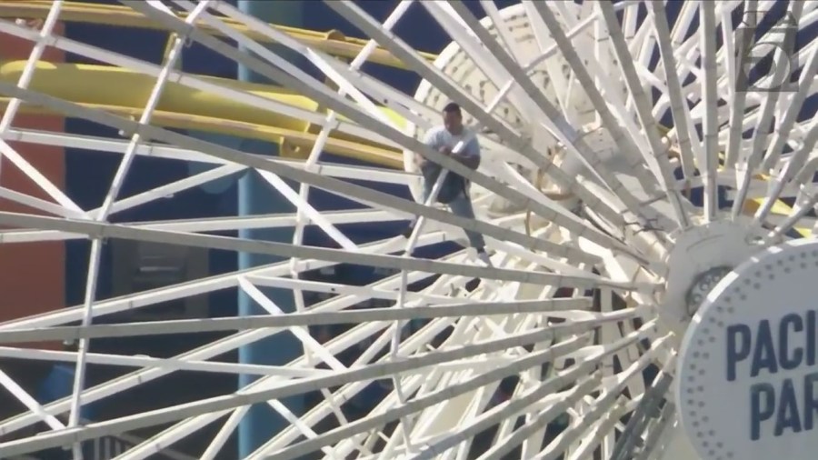 The Santa Monica Pier was evacuated Monday afternoon after a man scaled the Ferris wheel and apparently claimed to have a bomb.