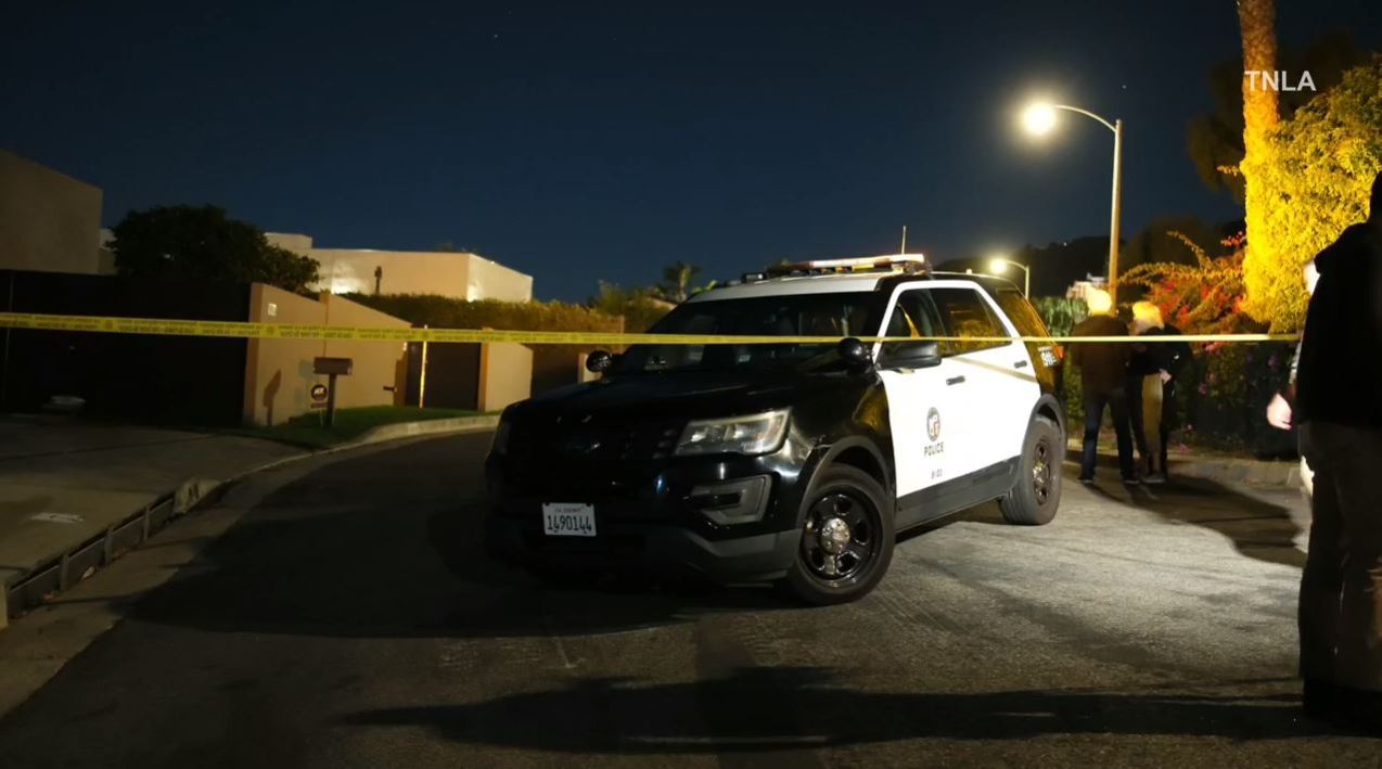 Law enforcement and loved ones arrive at Matthew Perry's Pacific Palisades home following news of the actor's death on Oct. 28, 2023. (TNLA)