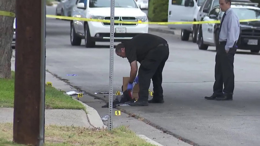 Investigators work the scene of a homicide in Orange, Calif. on Aug. 21, 2017. Richard Villeda was murdered in a hit allegedly ordered by the leader of the Orange County Mexican Mafia. (KTLA)