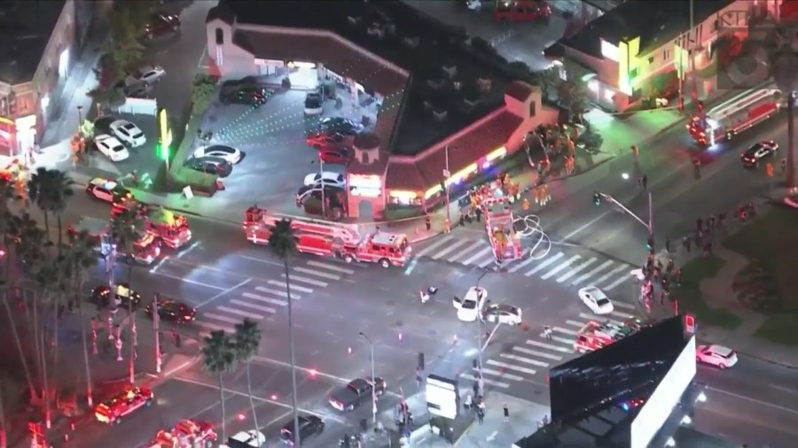 At least one person is hospitalized after a three-vehicle collision sent a truck crashing through a pizza shop in Hollywood on Oct. 31, 2023. (KTLA)