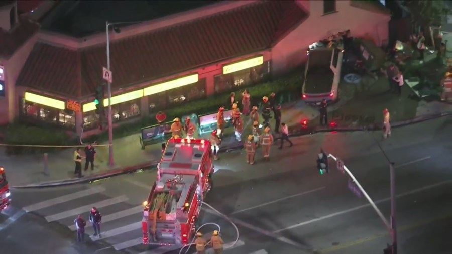 At least one person is hospitalized after a three-vehicle collision sent a truck crashing through a pizza shop in Hollywood on Oct. 31, 2023. (KTLA)