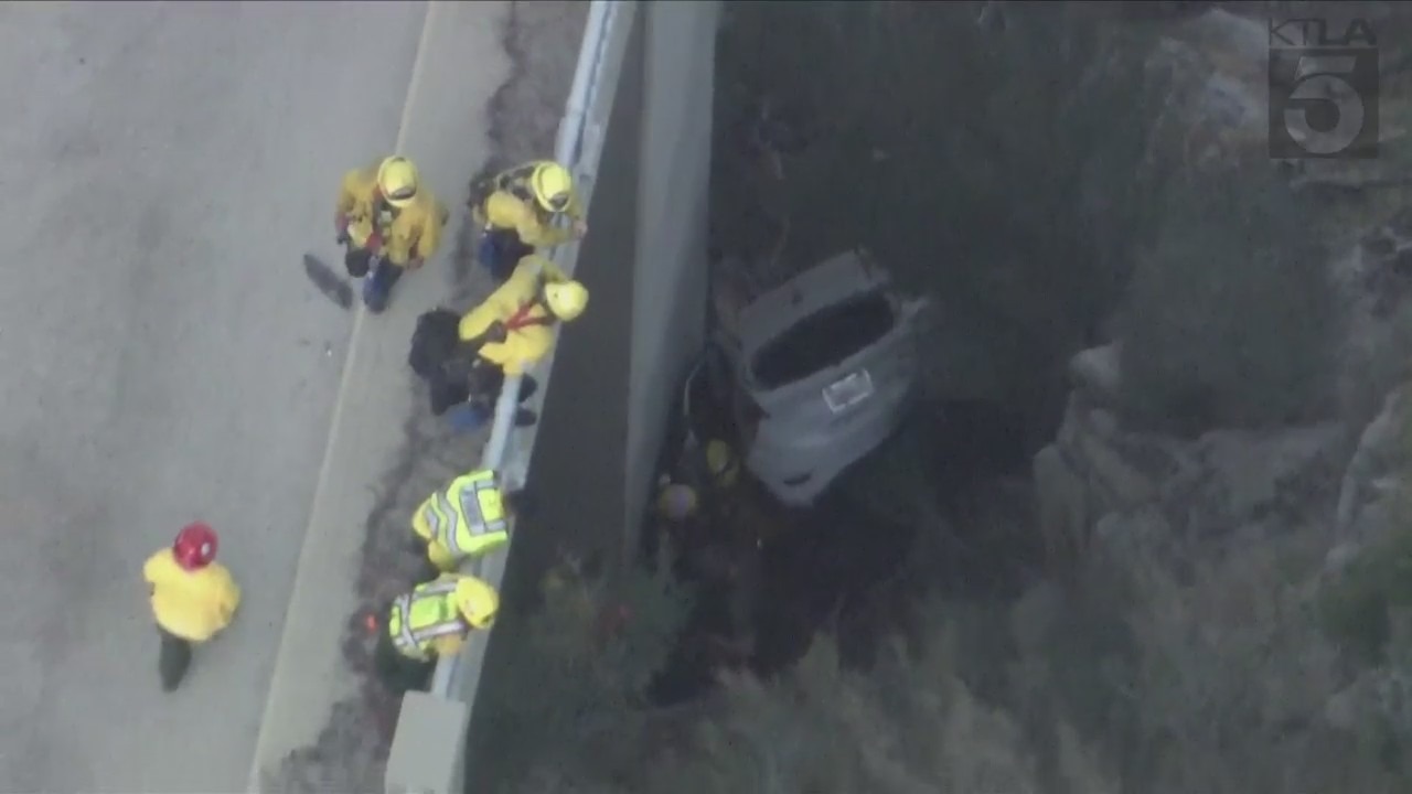 A trapped driver was rescued by crews after crashing off the side of a bridge in the Angeles National Forest on Oct. 6, 2023. (KTLA)