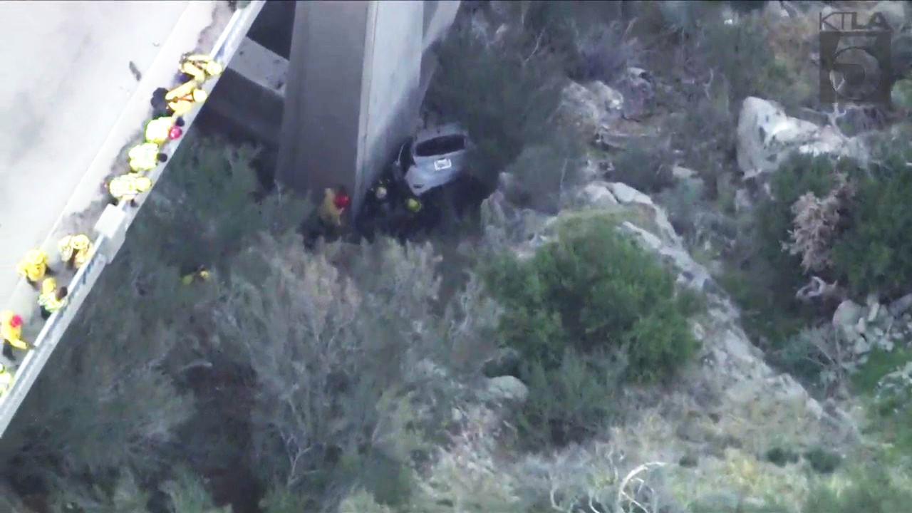 A trapped driver was rescued by crews after crashing off the side of a bridge in the Angeles National Forest on Oct. 6, 2023. (KTLA)