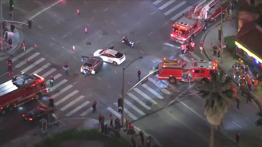 At least one person is hospitalized after a three-vehicle collision sent a truck crashing through a pizza shop in Hollywood on Oct. 31, 2023. (KTLA)