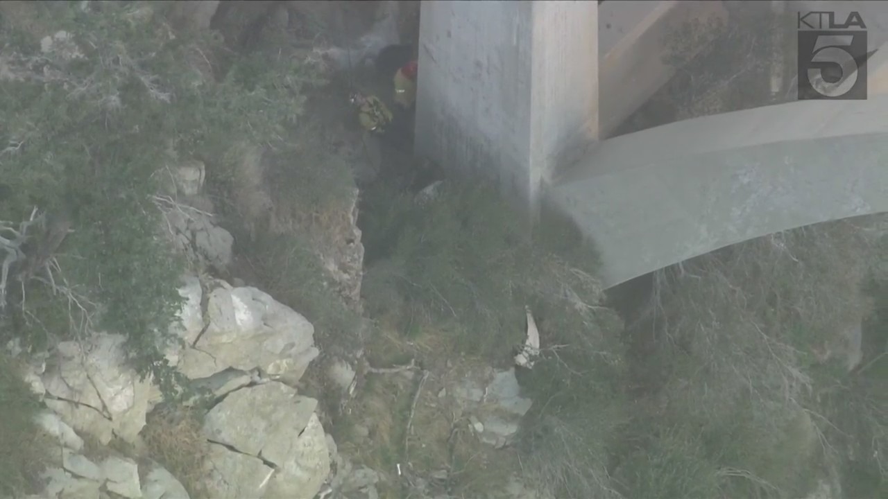 A trapped driver was rescued by crews after crashing off the side of a bridge in the Angeles National Forest on Oct. 6, 2023. (KTLA)