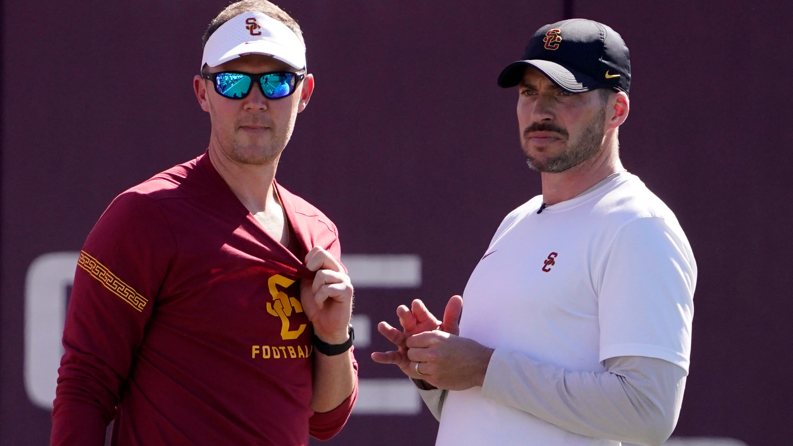 FILE - Southern California head coach Lincoln Riley, left, talks with defensive coordinator Alex Grinch during an NCAA college football practice Thursday, March 24, 2022, in Los Angeles. Southern California fired defensive coordinator Alex Grinch Sunday, Nov. 5, 2023, with two games left in the Trojans' disappointing regular season.(AP Photo/Mark J. Terrill, File)