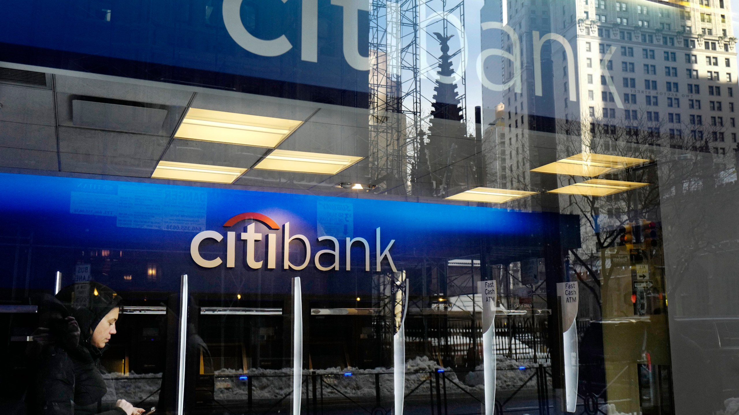 FILE - In this March 16, 2017, file photo, a customer enters a Citibank branch, in New York. Citigroup intentionally discriminated against Armenian Americans when they applied for credit cards, the Consumer Financial Protection Bureau said Wednesday, Nov. 8, 2023. (AP Photo/Mark Lennihan, File)