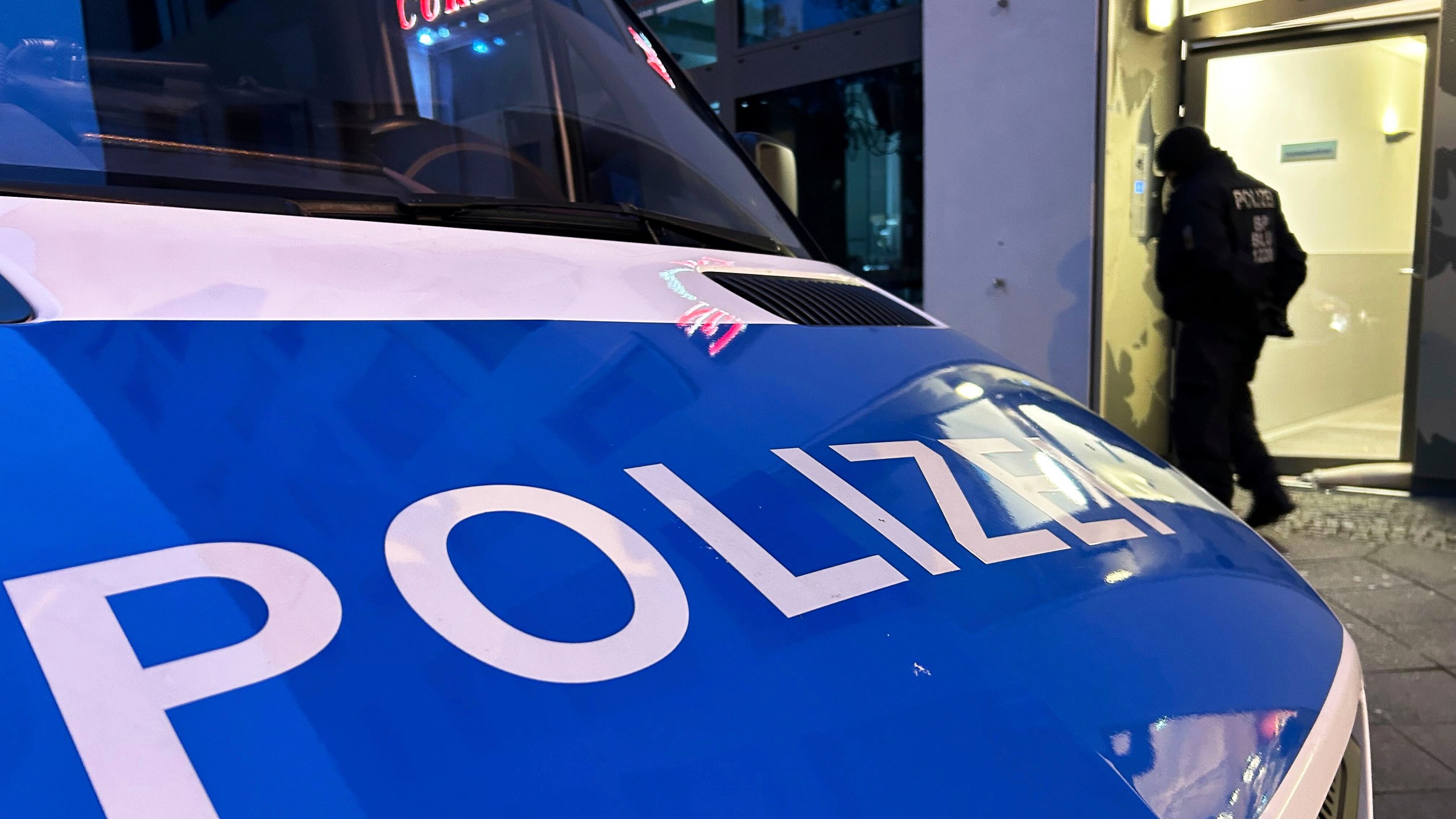 A police vehicle stands on the street during a raid in Berlin-Adlershof in Berlin, Thursday, Nov. 23, 2023. Hundreds of police officers searched the properties of Hamas members and followers in Germany on Thursday morning with the majority of the raids taking place in Berlin.(Sven Kaeuler/dpa via AP)