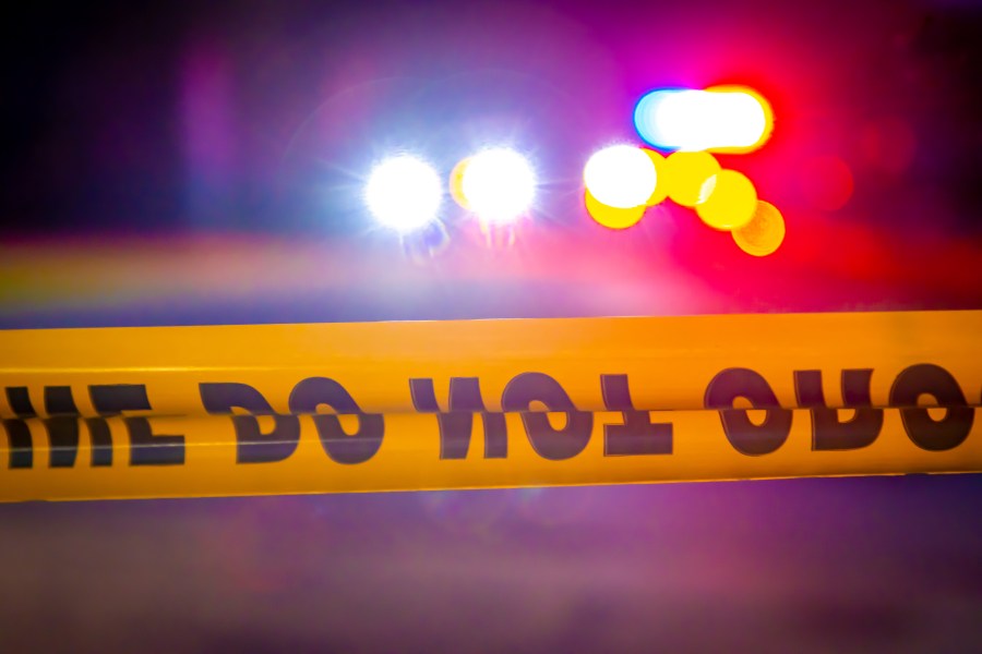 Police lights and crime scene tape are seen in this file image.