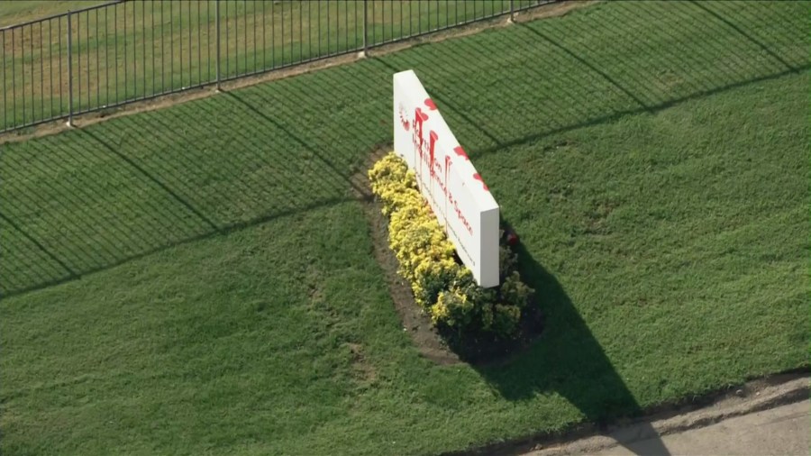 Red paint on Raytheon sign