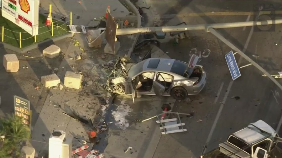 Three people were hospitalized after a pursuit ended with a destructive crash in Long Beach on Nov. 24, 2023. (KTLA)