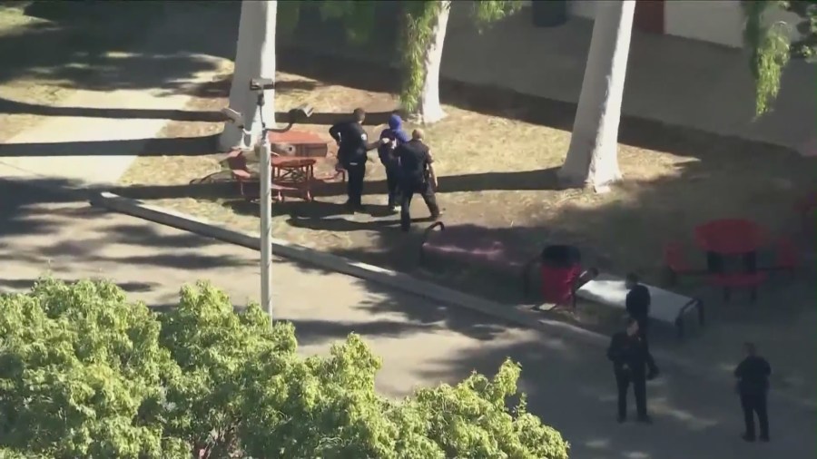 Suspect being detained after two students were stabbed as a violent brawl broke out at Van Nuys High School on Nov. 1, 2023. (KTLA)