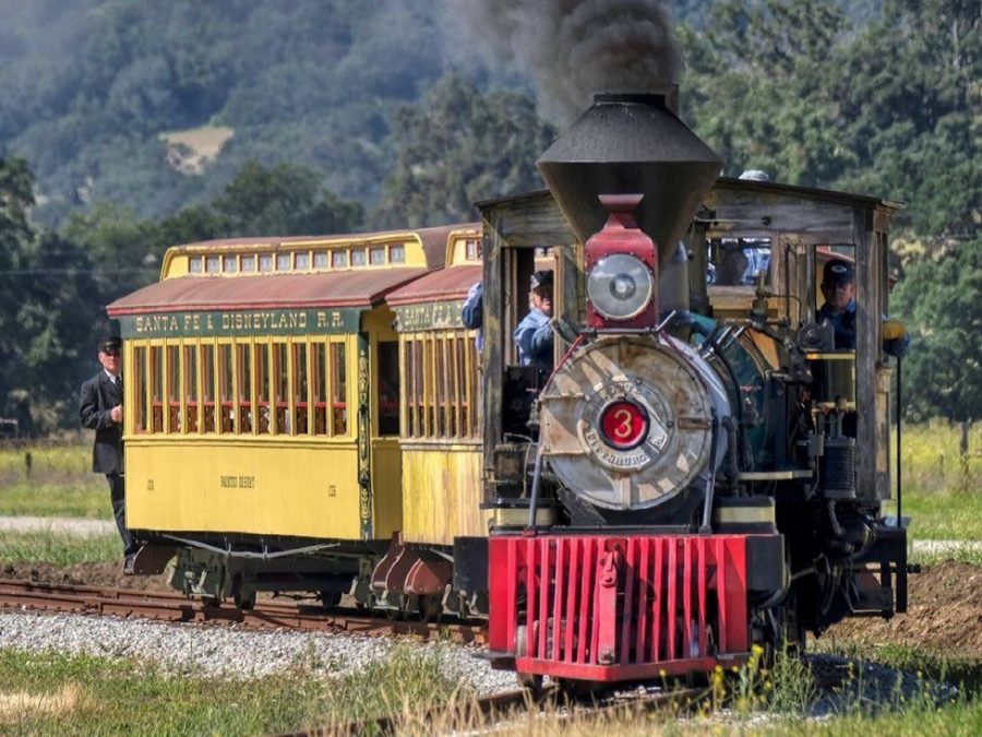 Two original Disneyland train cars are pulled by an 1800s steam engine at Santa Margarita Ranch in San Luis Obispo County in this undated photo. (Santa Margarita Ranch)