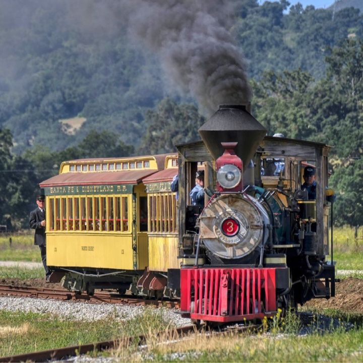 Two original Disneyland train cars are pulled by an 1800s steam engine at Santa Margarita Ranch in San Luis Obispo County in this undated photo. (Santa Margarita Ranch)