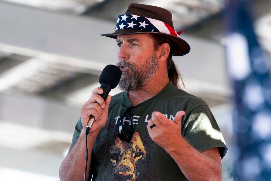 FILE - Alan Hostetter speaks during a pro-Trump election integrity rally he organized at the Orange County Registrar of Voters offices in Santa Ana, Calif., Nov. 9, 2020. Hostetter, a former California police chief convicted of a conspiracy charge in the U.S. Capitol riot was sentenced to more than 11 years in prison on Thursday, Dec. 7, 2023, after giving a speech that praised Republican presidential candidate Vivek Ramaswamy's suggestion the Jan. 6, 2021, attack could have been an "inside job." (Paul Bersebach/The Orange County Register via AP, File)