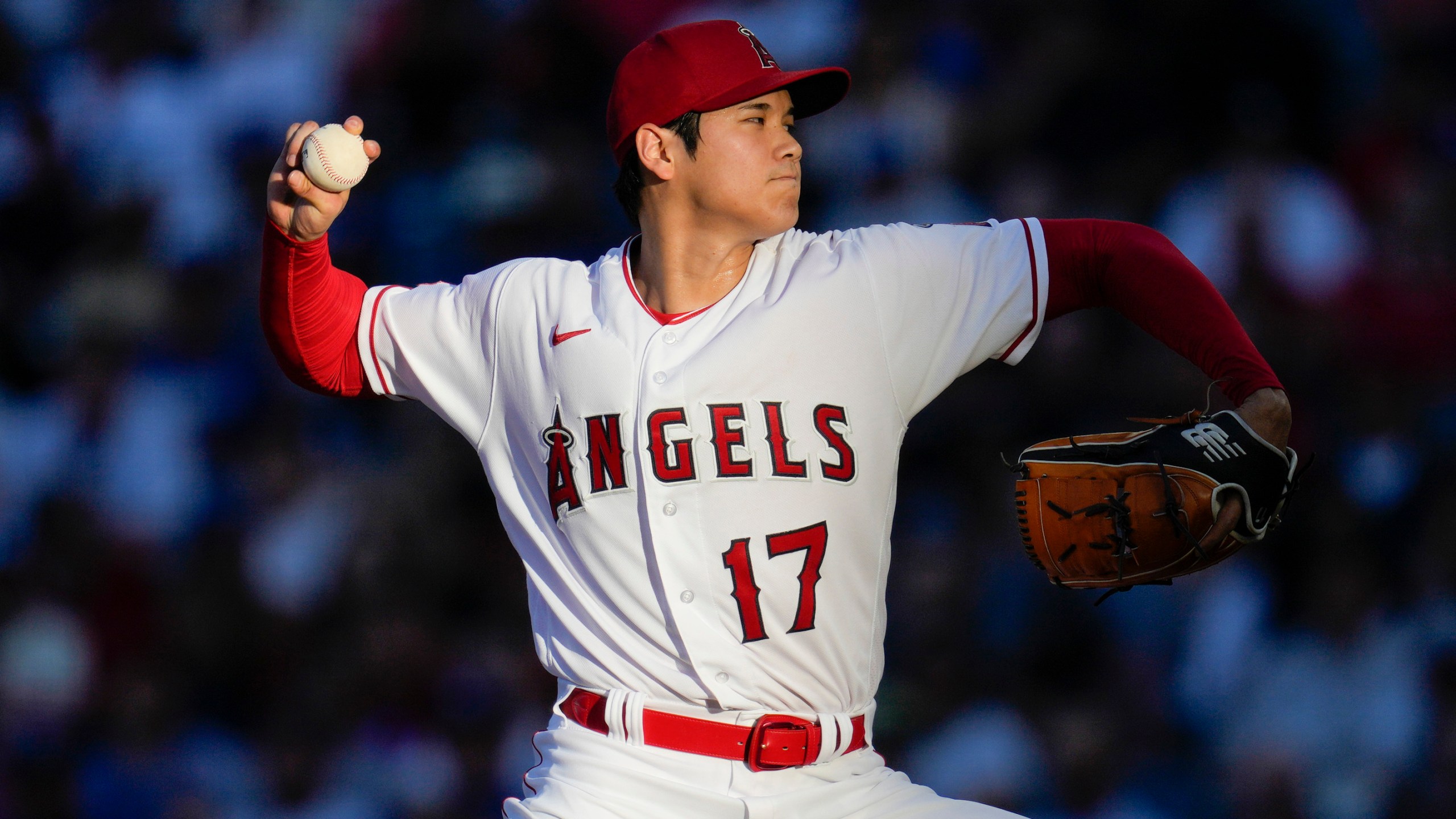 FILE - Los Angeles Angels starting pitcher Shohei Ohtani throws during a baseball game against the Los Angeles Dodgers in Anaheim, Calif., June 21, 2023. Ohtani agreed Saturday, Dec. 9, to a record $700 million, 10-year contract with the Dodgers. (AP Photo/Ashley Landis, File)