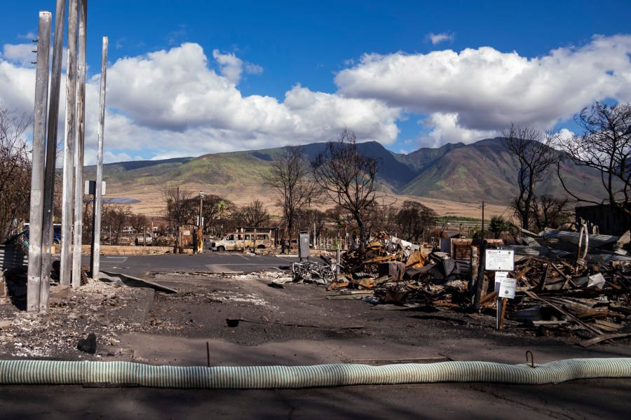 Debris of former shops and businesses on Front Street in burn zone 11A is pictured Dec. 8, 2023, in Lahaina, Hawaii. The area reopened Monday, Dec. 11, to residents and owners with entry passes. (AP Photo/Lindsey Wasson)