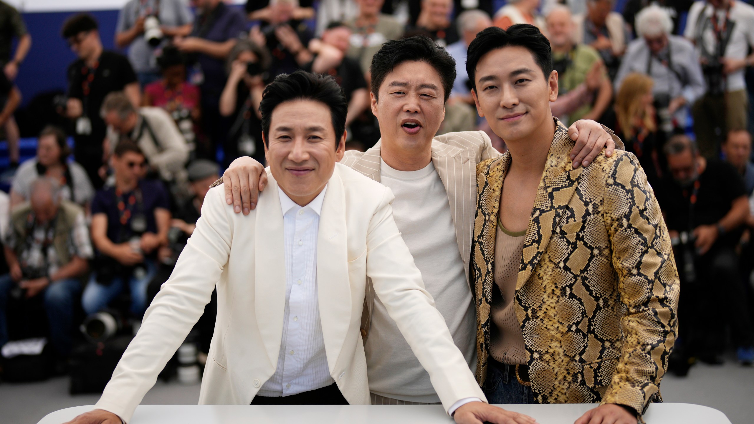 FILE - Lee Sun-kyun, from left, Kim Hee-won and Ju Ji-hoon poses for photographers at the photo call for the film 'Project Silence' at the 76th international film festival, Cannes, southern France, on May 22, 2023. Police says actor Lee Sun-kyun of the Oscar-winning “Parasite” has been found unconscious. Seoul police said police officers discovered an unconscious Lee at an unidentified Seoul site on Wednesday, Dec. 27, but gave no further details. (AP Photo/Daniel Cole, File)