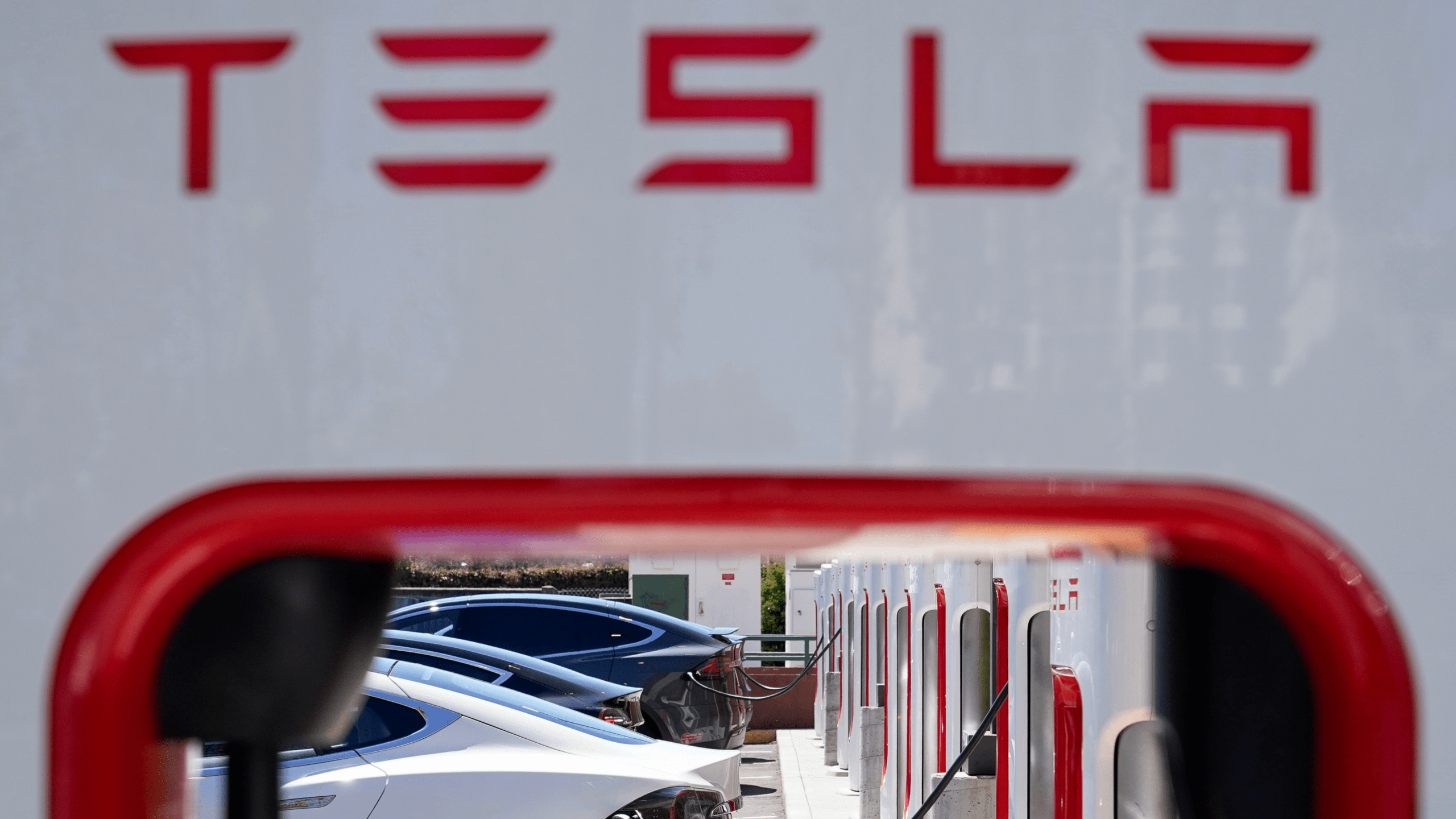 Tesla vehicles charge at a station in Emeryville, Calif., Wednesday, Aug. 10, 2022.