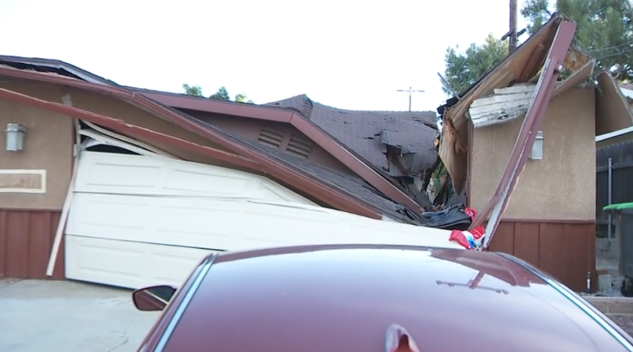 Toppled crane crushes portion of family's home