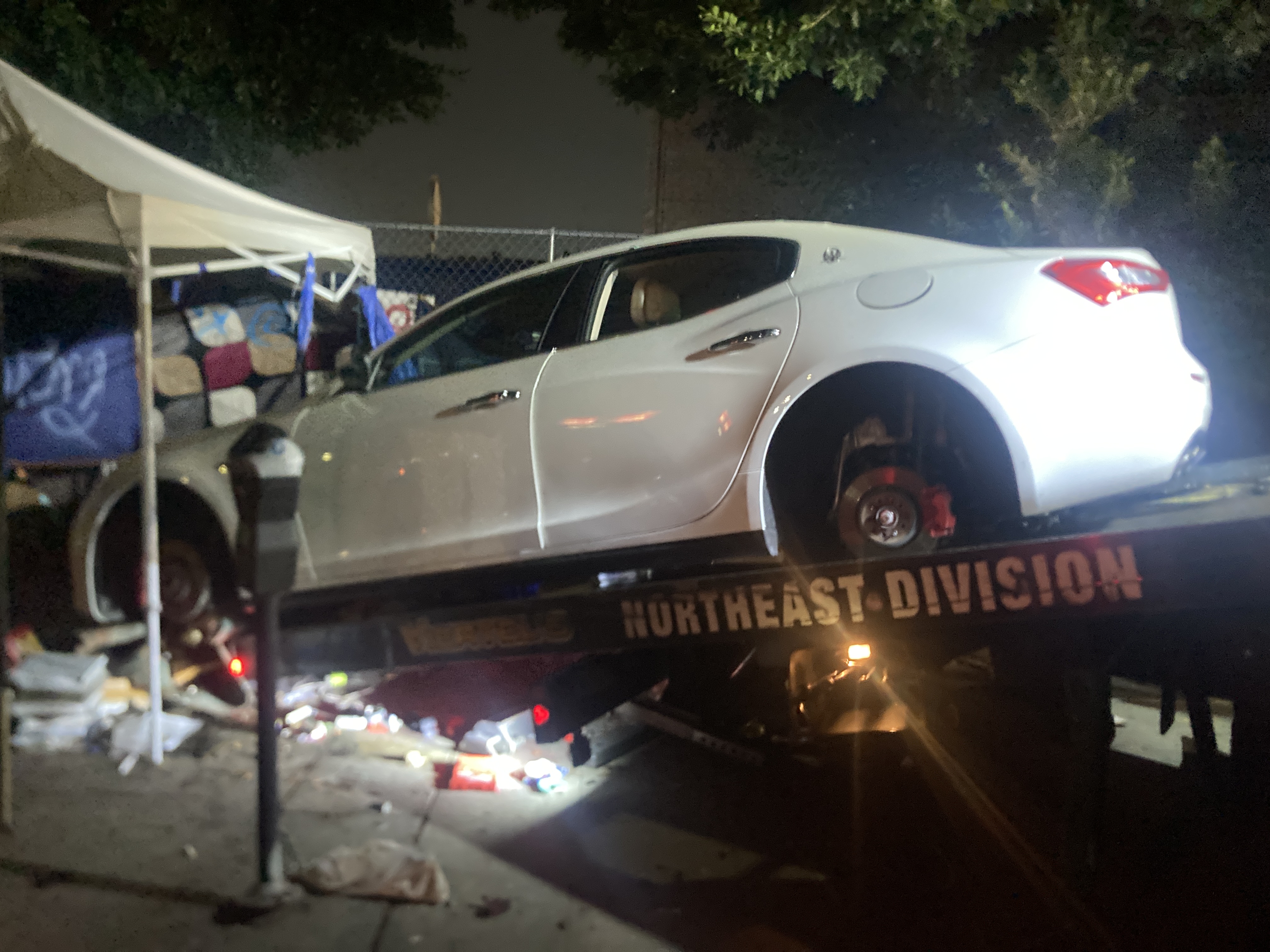 Three suspects were arrested after police found a stolen Maserati being stripped in downtown Los Angeles on Dec. 27, 2023. (Los Angeles Police Department)