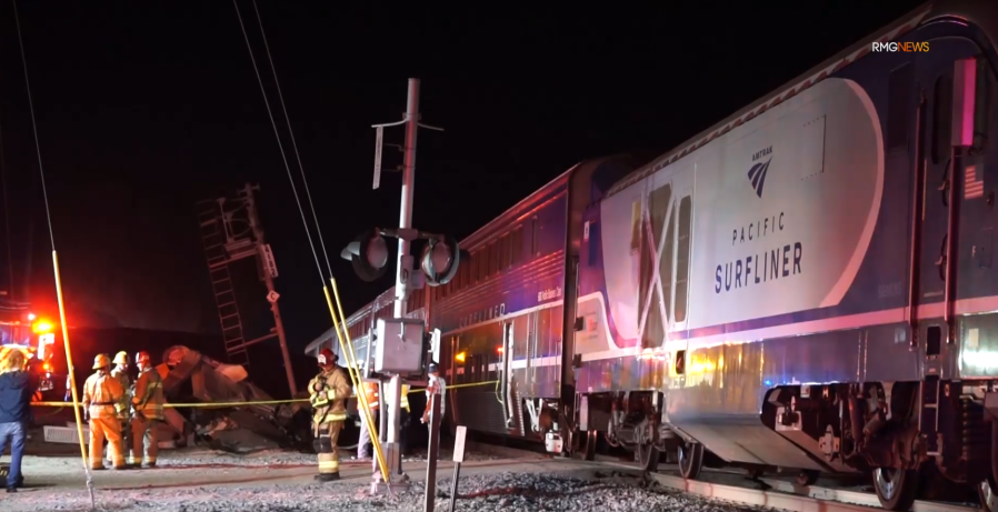 5 hospitalized after crash between train and semi-truck