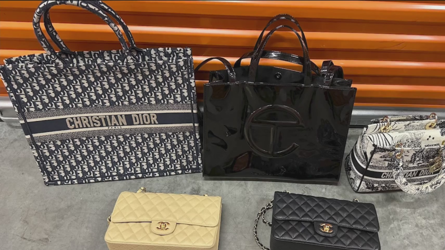 The designer handbags found in the suspect's home that was taken from the victim's apartment. (Brittney Heinzman)