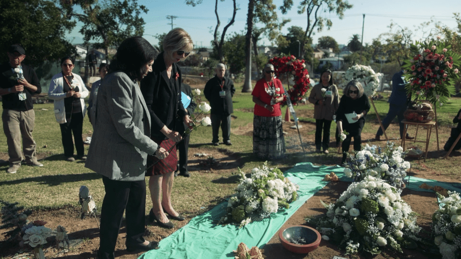 Los Angeles County Supervisors Hilda Solis and Janice Hahn lay flowers at the grave where the remains of 1,900 people were laid to rest during L.A. County annual Ceremony of the Unclaimed Dead on Dec. 14, 2023. (Los Angeles County Department of Health Services)