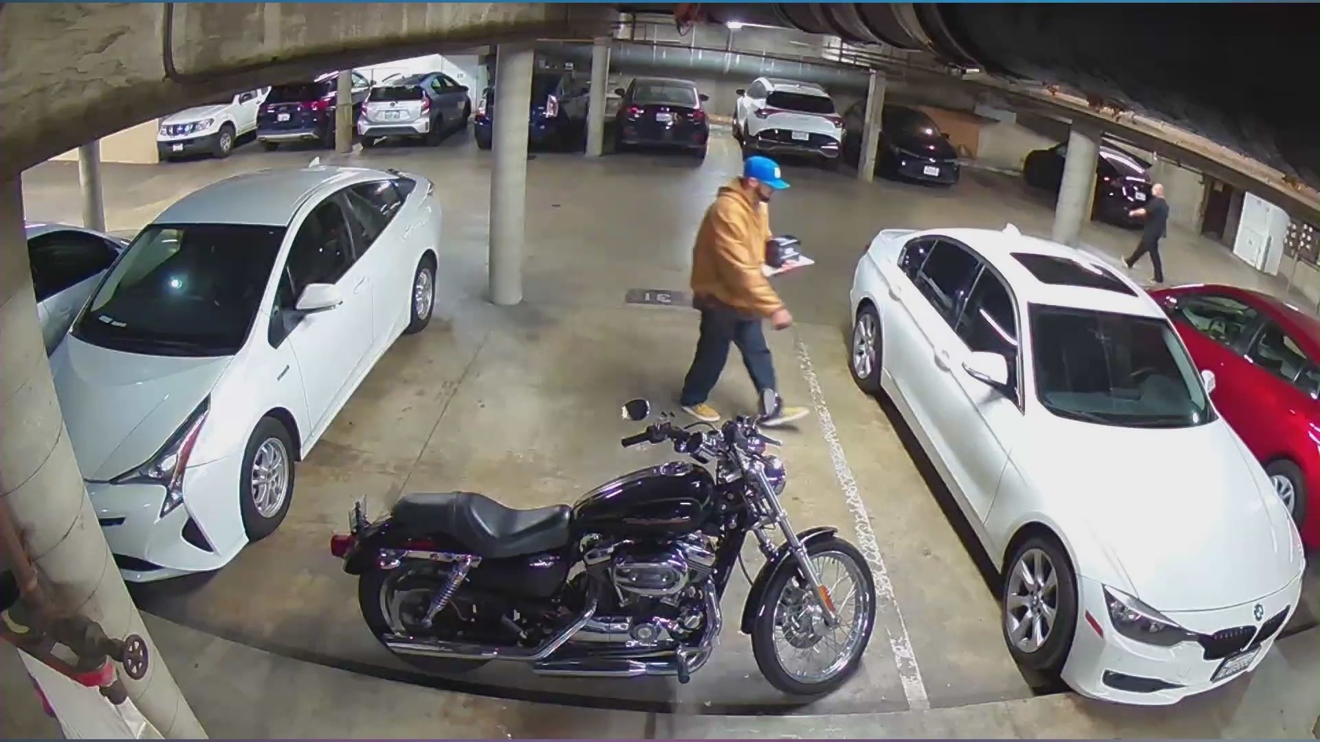 Surveillance footage of two suspects wanted for allegedly stealing thousands of dollars worth of music equipment from inside a gated Hollywood parking garage on Dec. 18, 2023. (Louise Van Veenendaal)