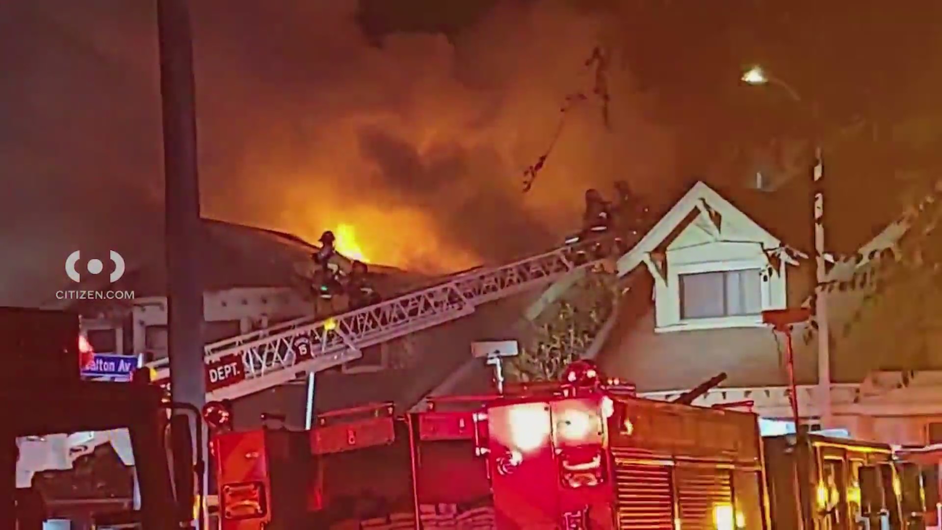 Video: Fire crews scramble to safety as fireball bursts through roof of home