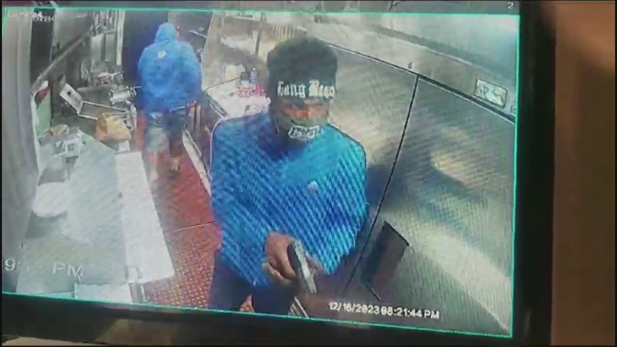 Surveillance video captured masked thieves storming into the Los Bros Tacos truck on Dec. 16, 2023 in Long Beach. (Los Bros Taco)