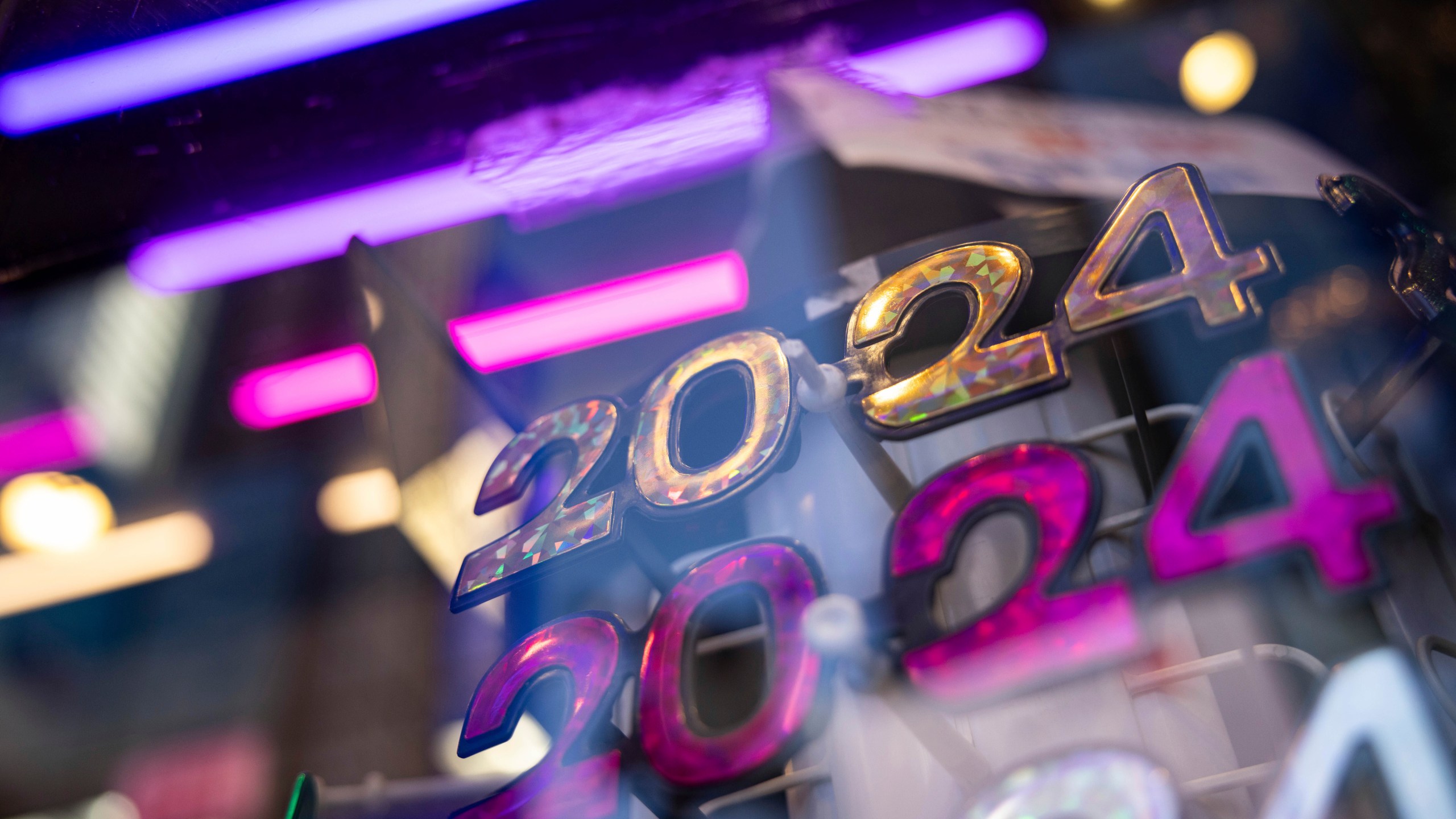 2024 glasses are displayed ahead of New Year's Eve in Times Square, Friday, Dec. 29, 2023, in New York. (AP Photo/Yuki Iwamura)