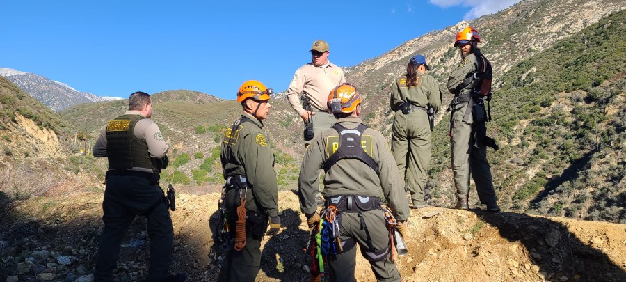 A woman was rescued after driving off a road and tumbling down a canyon in the San Gabriel Mountains on Jan. 7, 2024. (San Dimas Mountain Rescue Team)