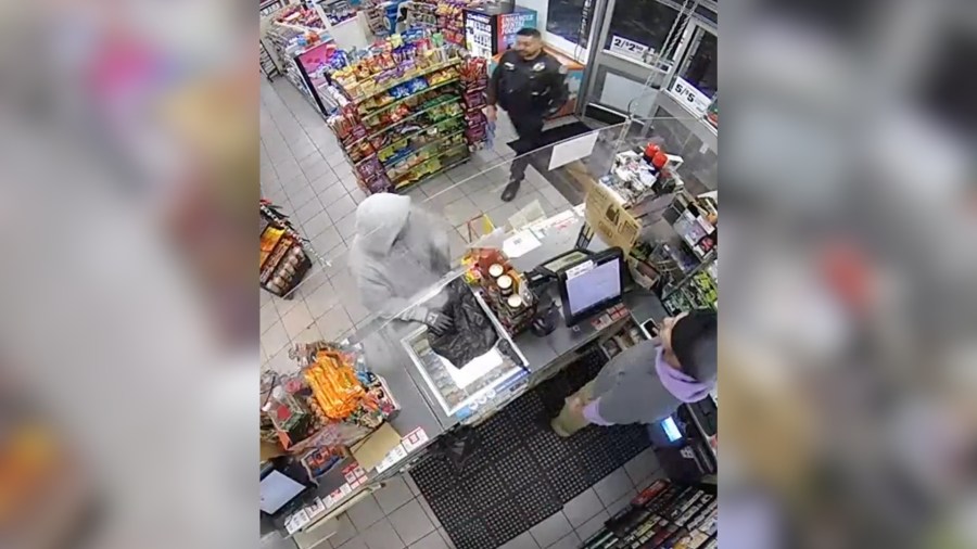 Police officer walks in 7-Eleven as armed robbery in progress