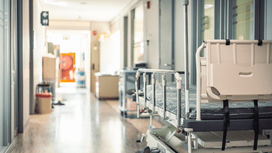 Hospital bed in hospital corridor