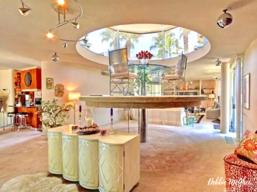 The mechanical lift is seen in action as it elevates the circular platform up toward the glass turret atop the home at 73345 Juniper St. in Palm Desert as shown in this undated photo. (Debbie McGhee/Homesmart)