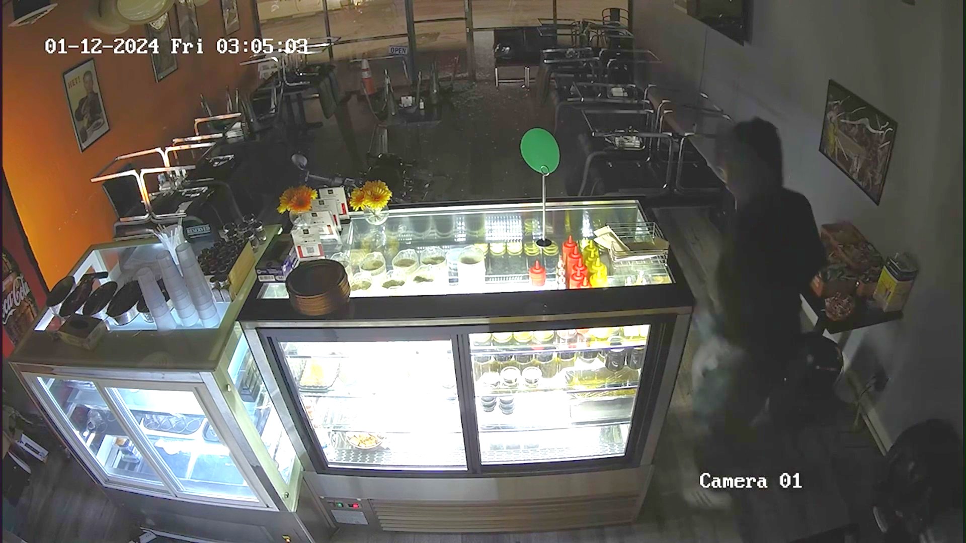 A hooded suspect used a large rock to smash his way into three small businesses before clearing out the cash registers in Woodland Hills on Jan. 12, 2024. (Pizza Polo)