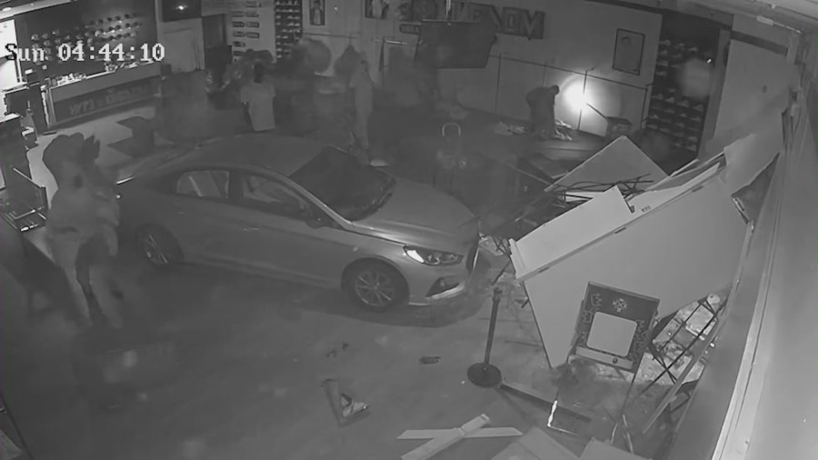 Suspects caught on video ramming government vehicle into storefront, stealing merchandise