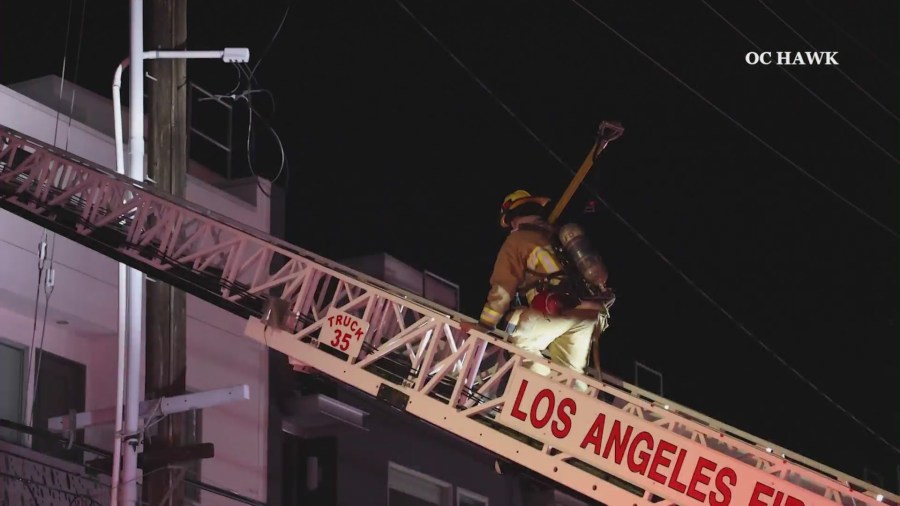 Structure fire threatens large apartment complex in Hollywood 