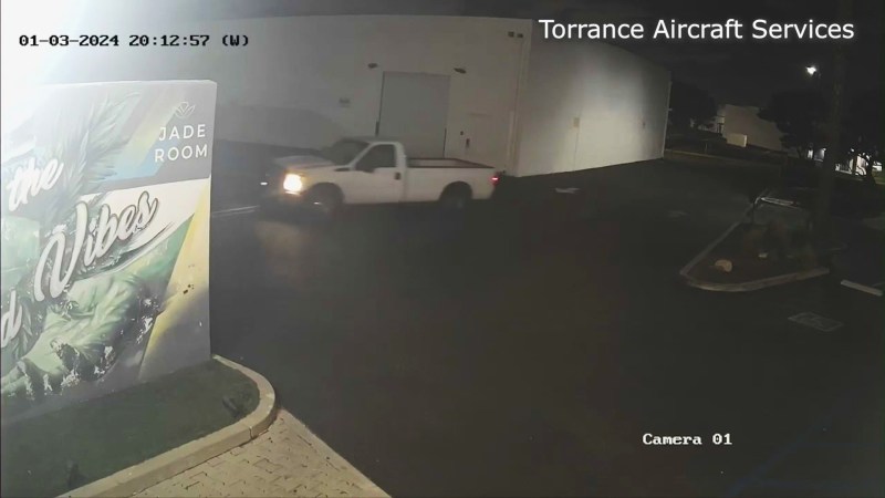 The suspect's white pickup truck arriving at a Torrance warehouse parking lot to steal a vintage Piper airplane on Jan. 3, 2024. (Anis Pradhan)