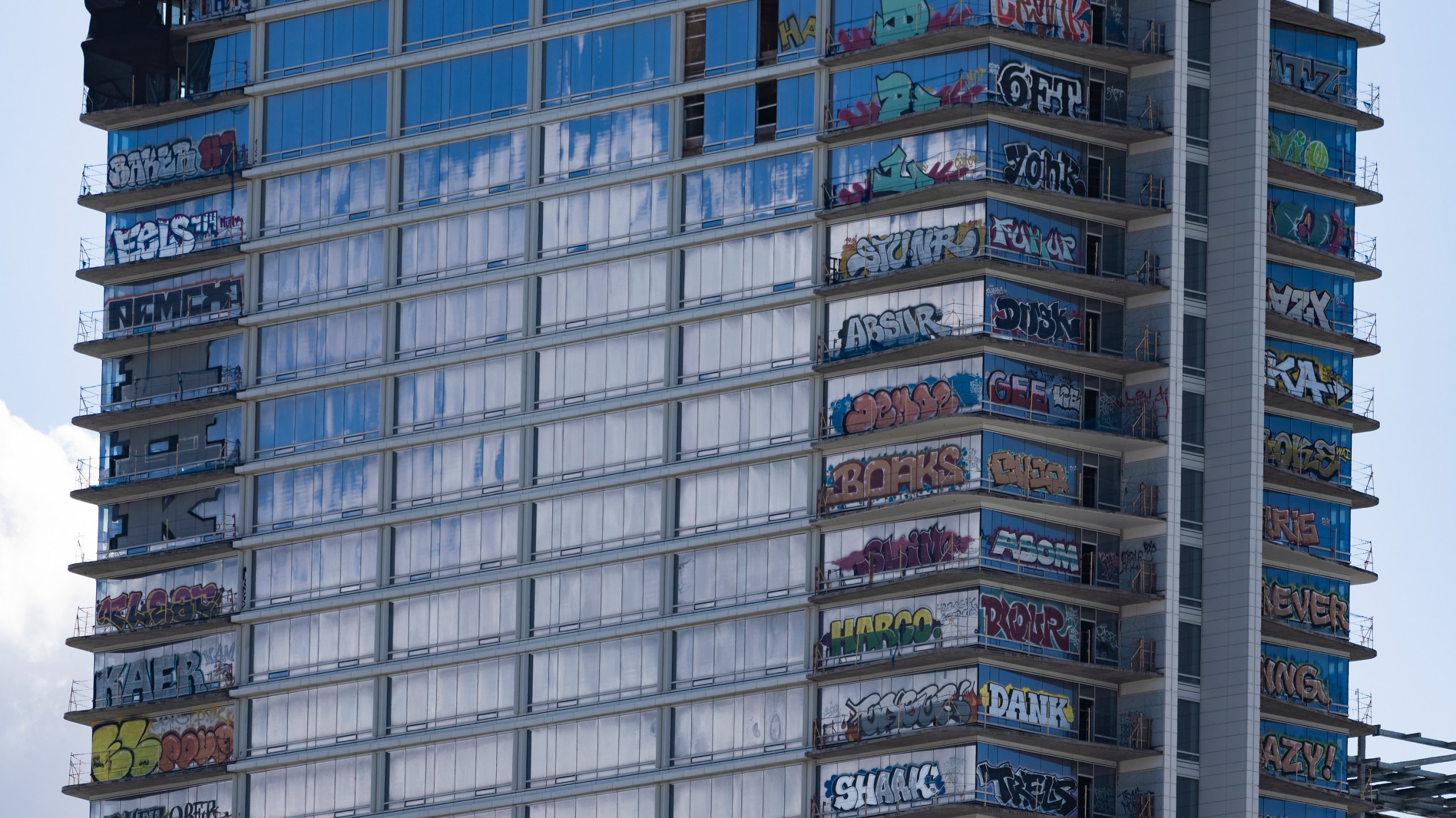 An unfinished high-rise development in the downtown entertainment district that has become the target of graffiti taggers who have struck dozens of floors is seen in Los Angeles on Friday, Feb. 2, 2024. (AP Photo/Damian Dovarganes)