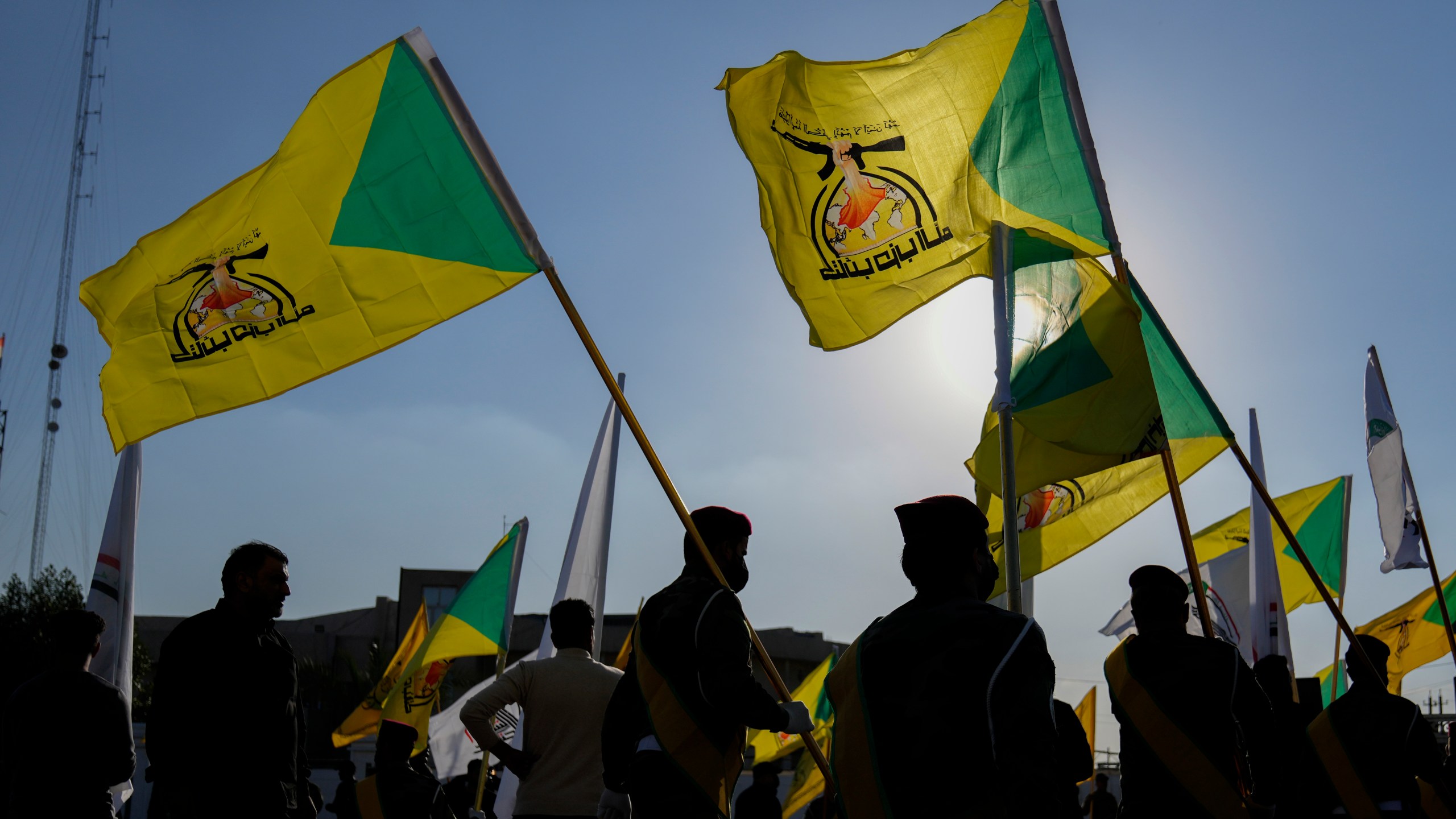 Fighters from the Popular Mobilization Forces, attends the funeral of a commander from the Kataib Hezbollah paramilitary group, Wissam Muhammad Sabir Al-Saadi, known as Abu Baqir Al-Saadi, who was killed in a U.S. airstrike, in Baghdad, Iraq, Thursday, Feb. 8, 2024. The U.S. military says a U.S. drone strike blew up a car in the Iraqi capital Wednesday night, killing the high-ranking commander. (AP Photo/Hadi Mizban)