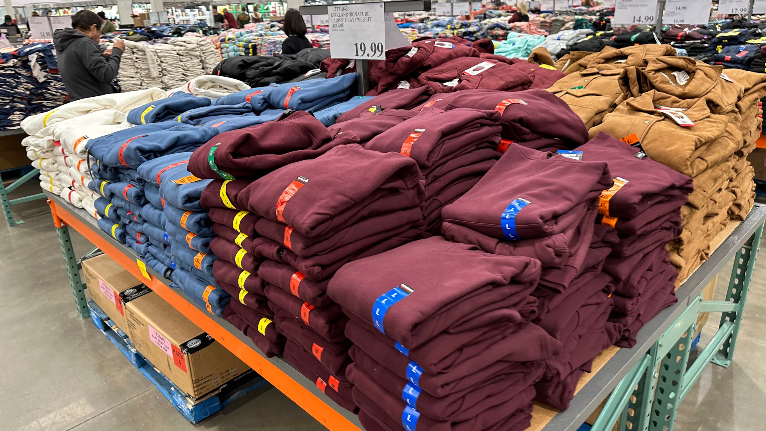 Shoppers peruse stacks of hoodies on display in a Costco warehouse Tuesday, Jan. 30, 2024, in Timnath, Colo. The Commerce Department releases U.S. retail sales data for January on Thursday, Feb. 15, 2024. (AP Photo/David Zalubowski)