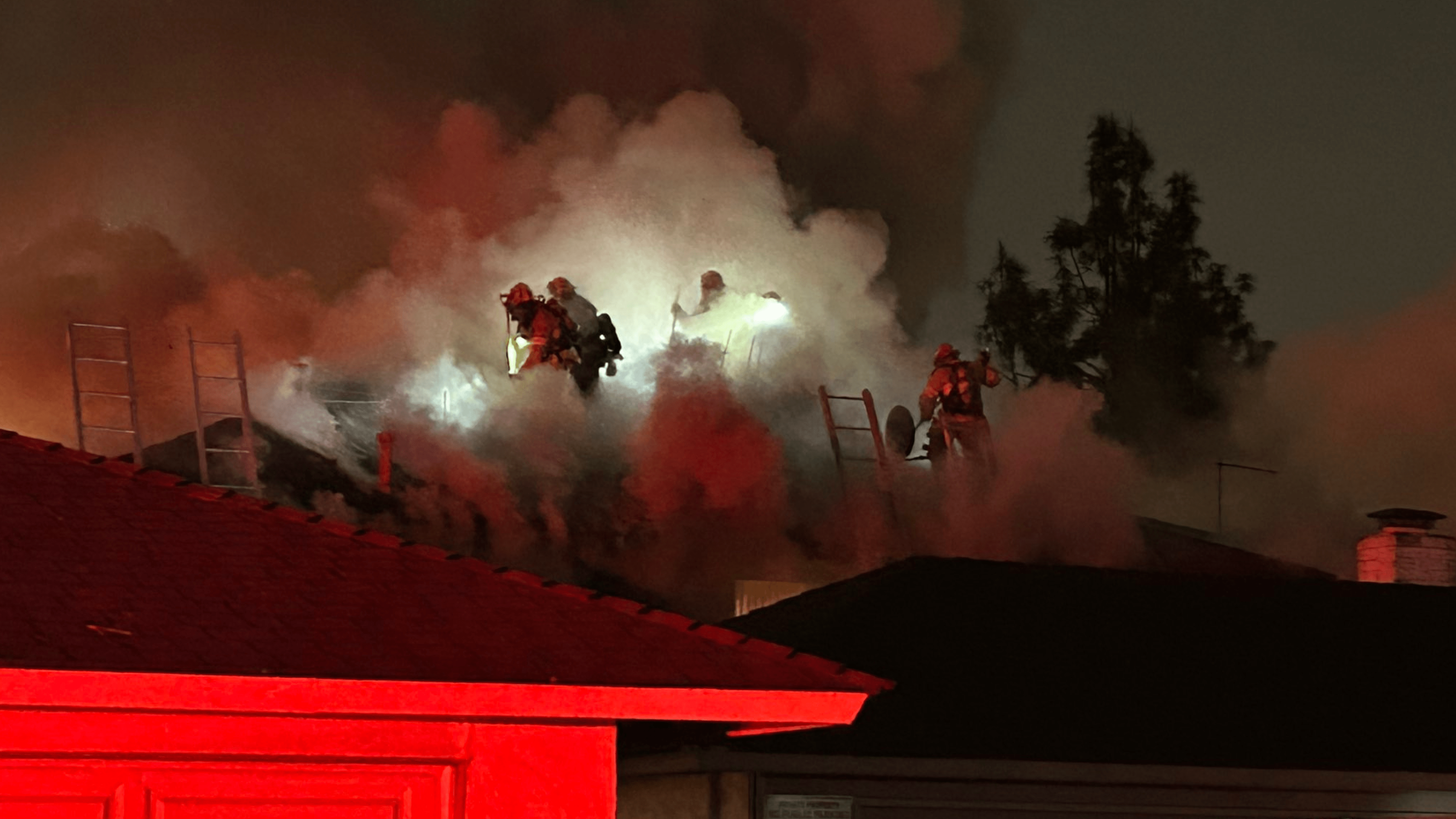 Firefighters respond to an apartment fire in Tustin on Feb. 7, 2024.