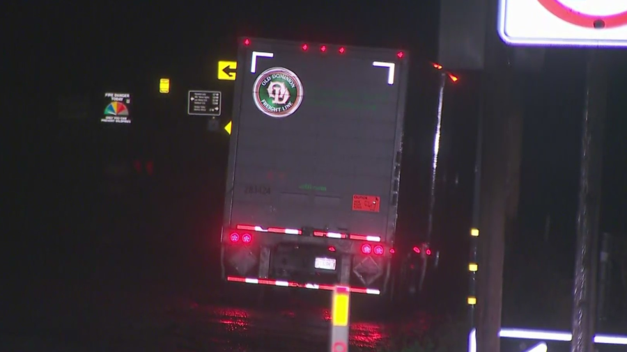 A big rig is seen on the side of the freeway in the Tejon Pass on Feb. 1, 2024.